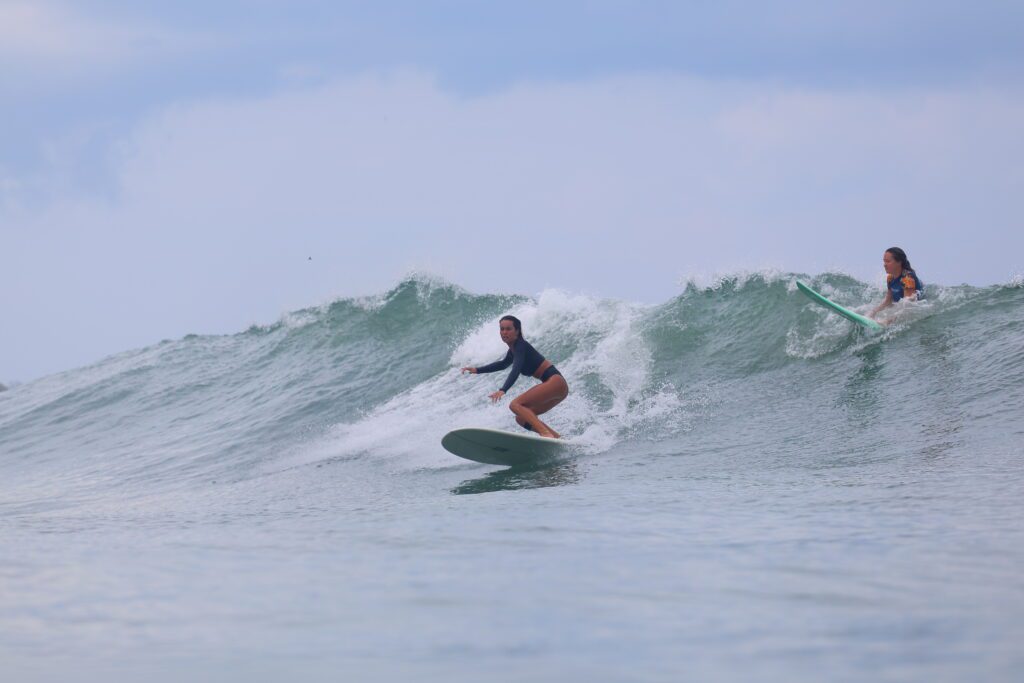 picture of a surfer on the emerald coast of Nicaragua surfing with Rancho Santana surf teachers