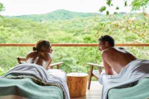 Man and woman getting a couples massage at Rancho's spa.