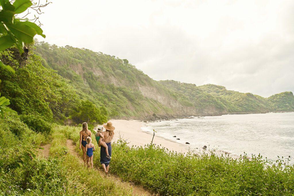 view of a family walking to playa Escondida in Rancho Santana
