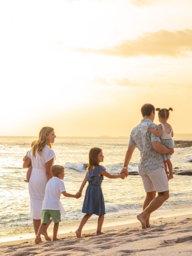 family walking on the beach of Playa Rosada at rancho santana