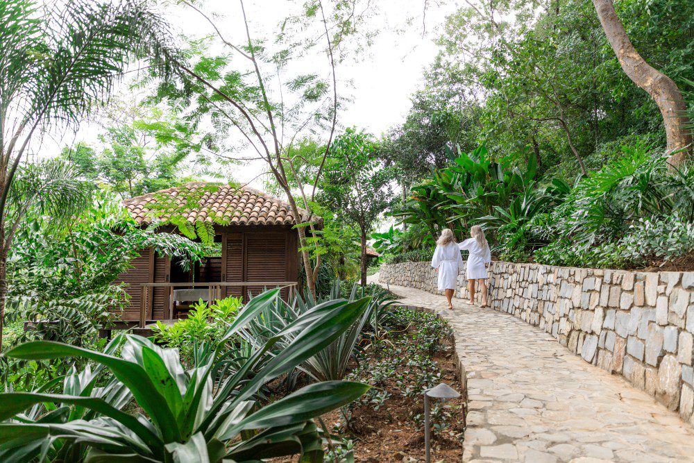 view of the women walking to the spa in el bosque at Rancho Santana
